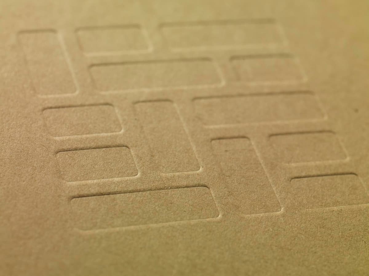 Close view of the Mosaic pattern debossed into the box