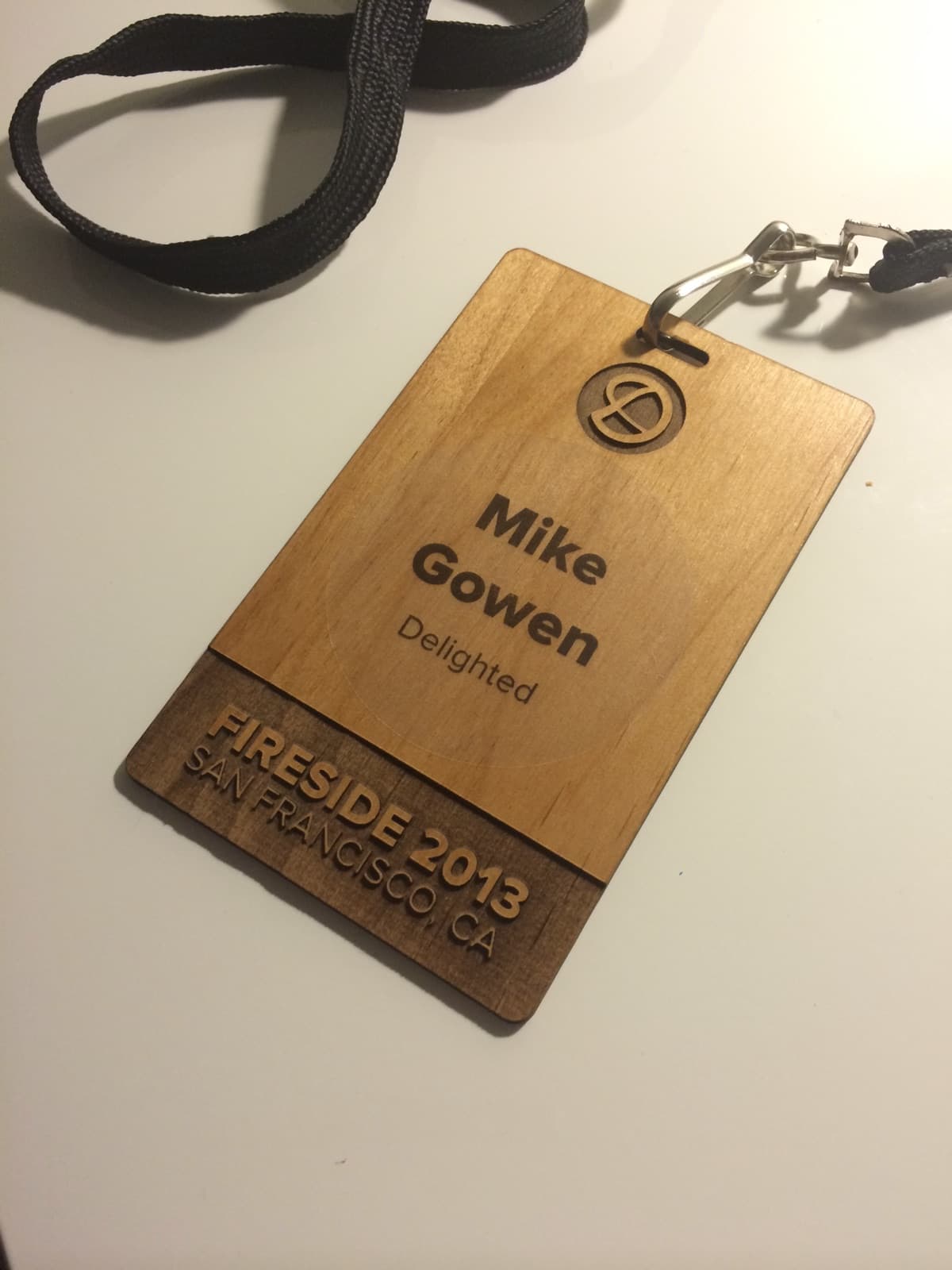 Laser-cut wooden Delighted fireside badge
