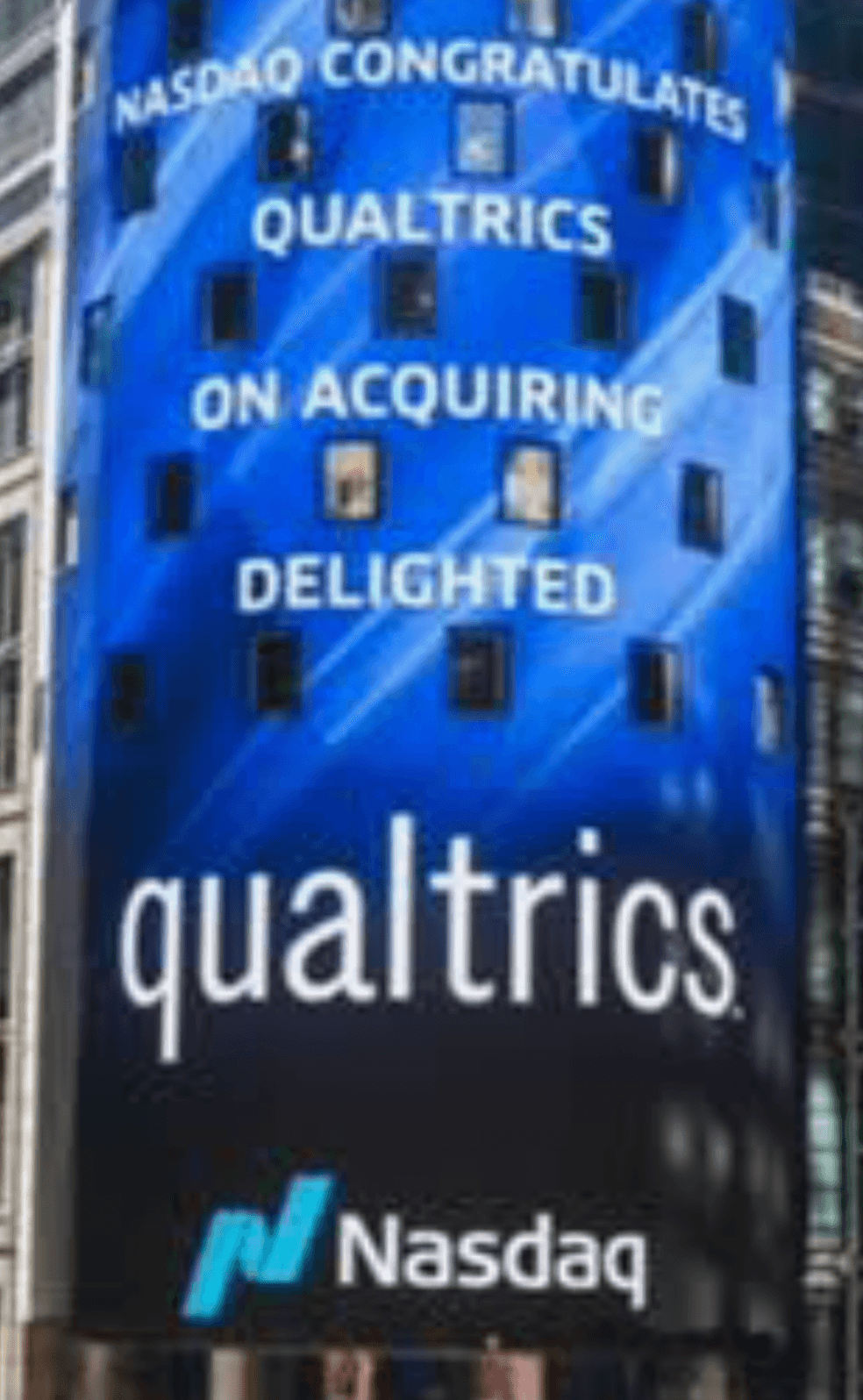 Nasdaq Times Square display congratulating Qualtrics on acquiring Delighted